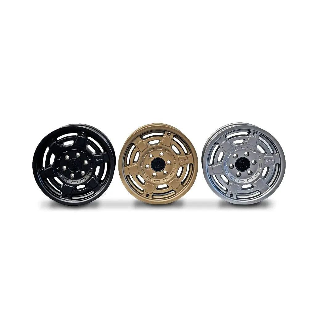 Mojo Wheels for INEOS Grenadier in black, gold, and silver, showcasing durability and clean design.
