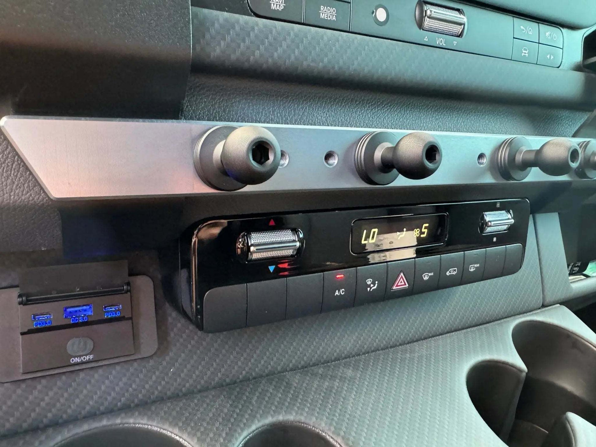 Powered Accessory Gear Rail installed in a Sprinter van interior.
