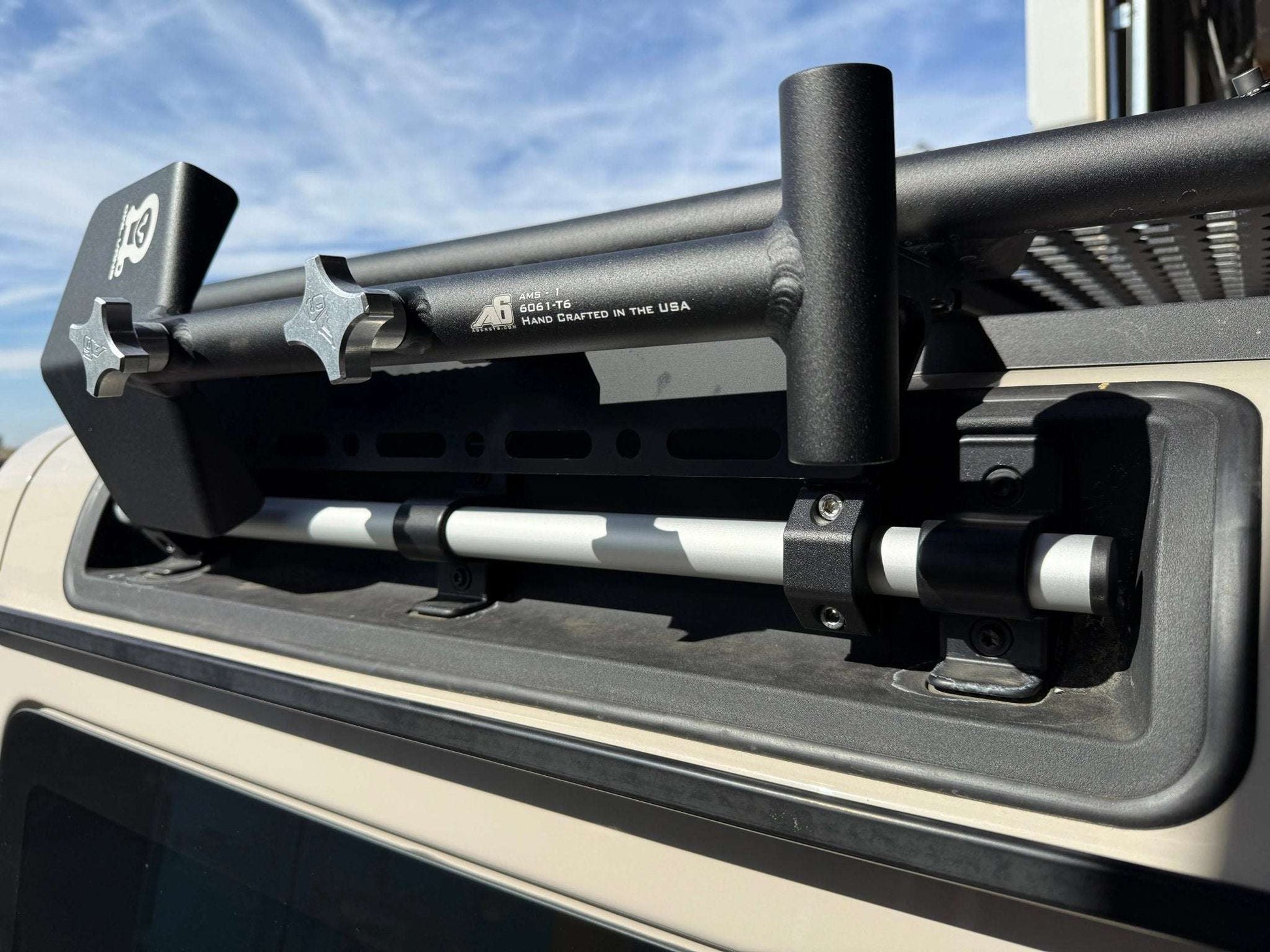 Roof rack gear panel mounted on INEOS Grenadier, featuring Owl's signature hole and slot design for versatile gear attachment.