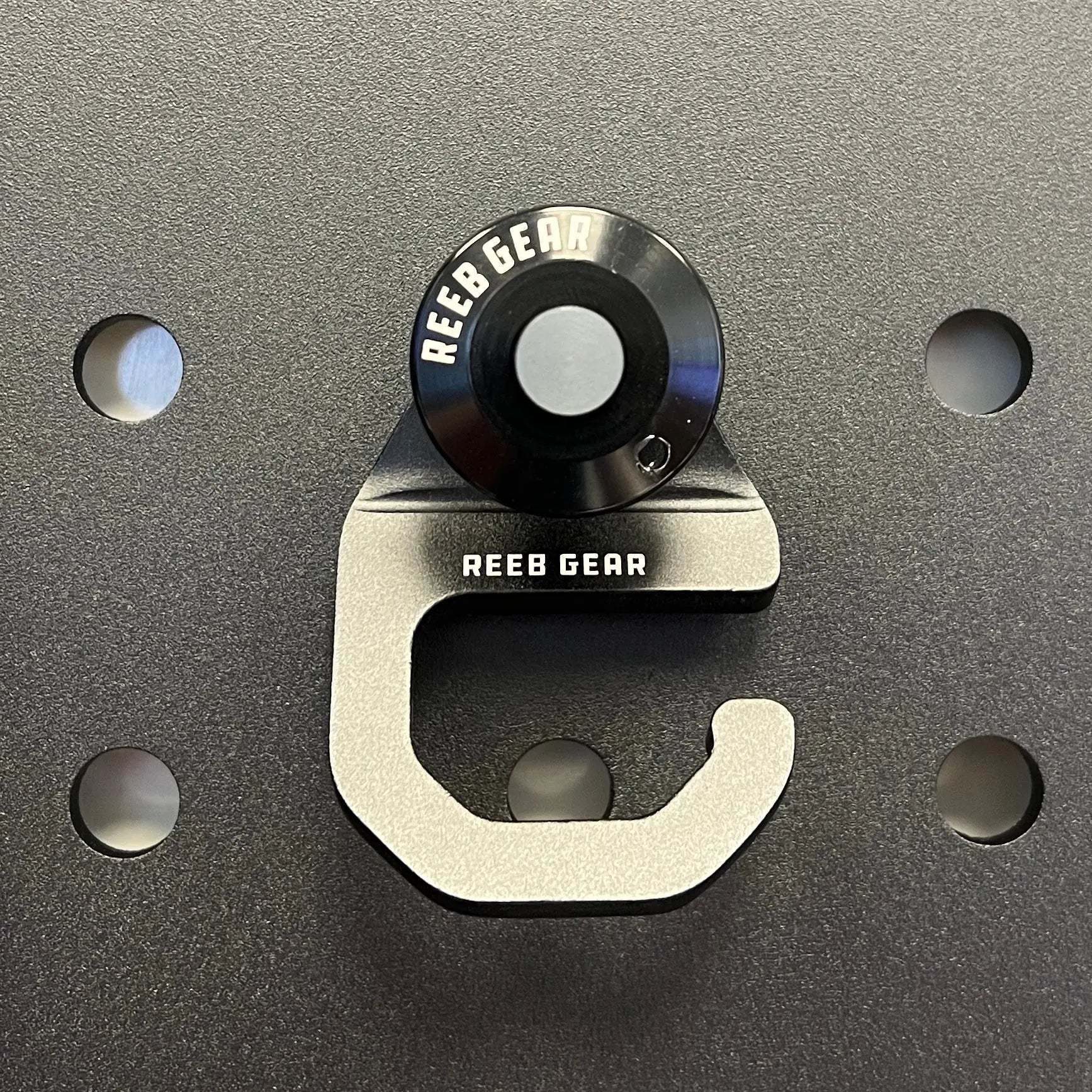 Sherpa Quick Release Hook by Reeb Gear in anodized aluminum for secure gear attachment on Sherpa panels