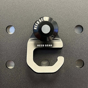 Sherpa Quick Release Hook by Reeb Gear in anodized aluminum for secure gear attachment on Sherpa panels