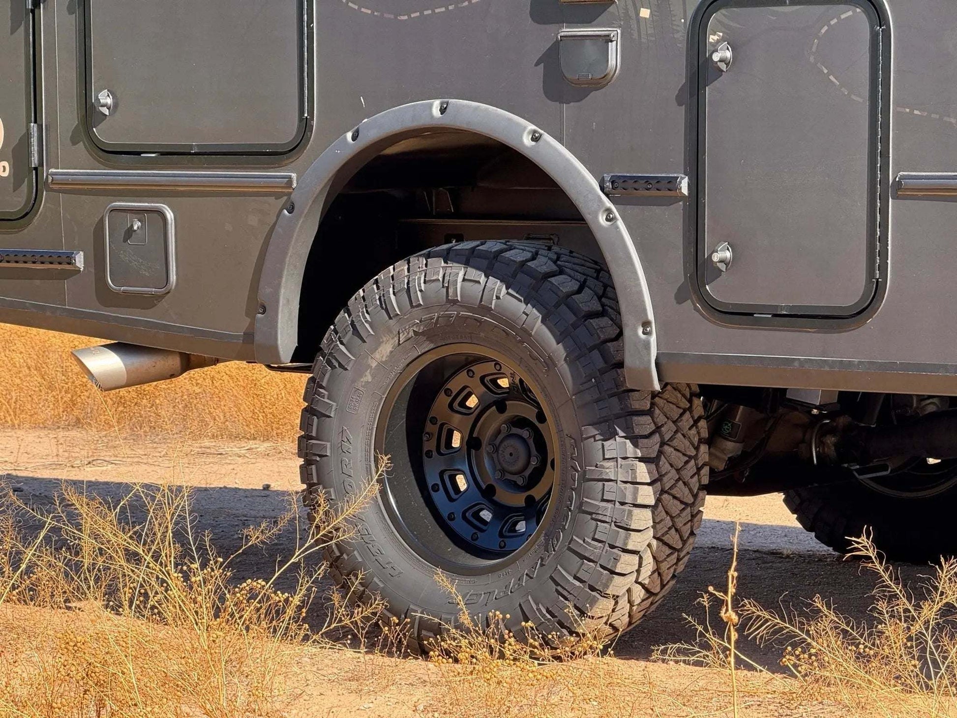 Talon Super Single off-road wheel set on Sprinter van with rugged tire tread for adventure and durability