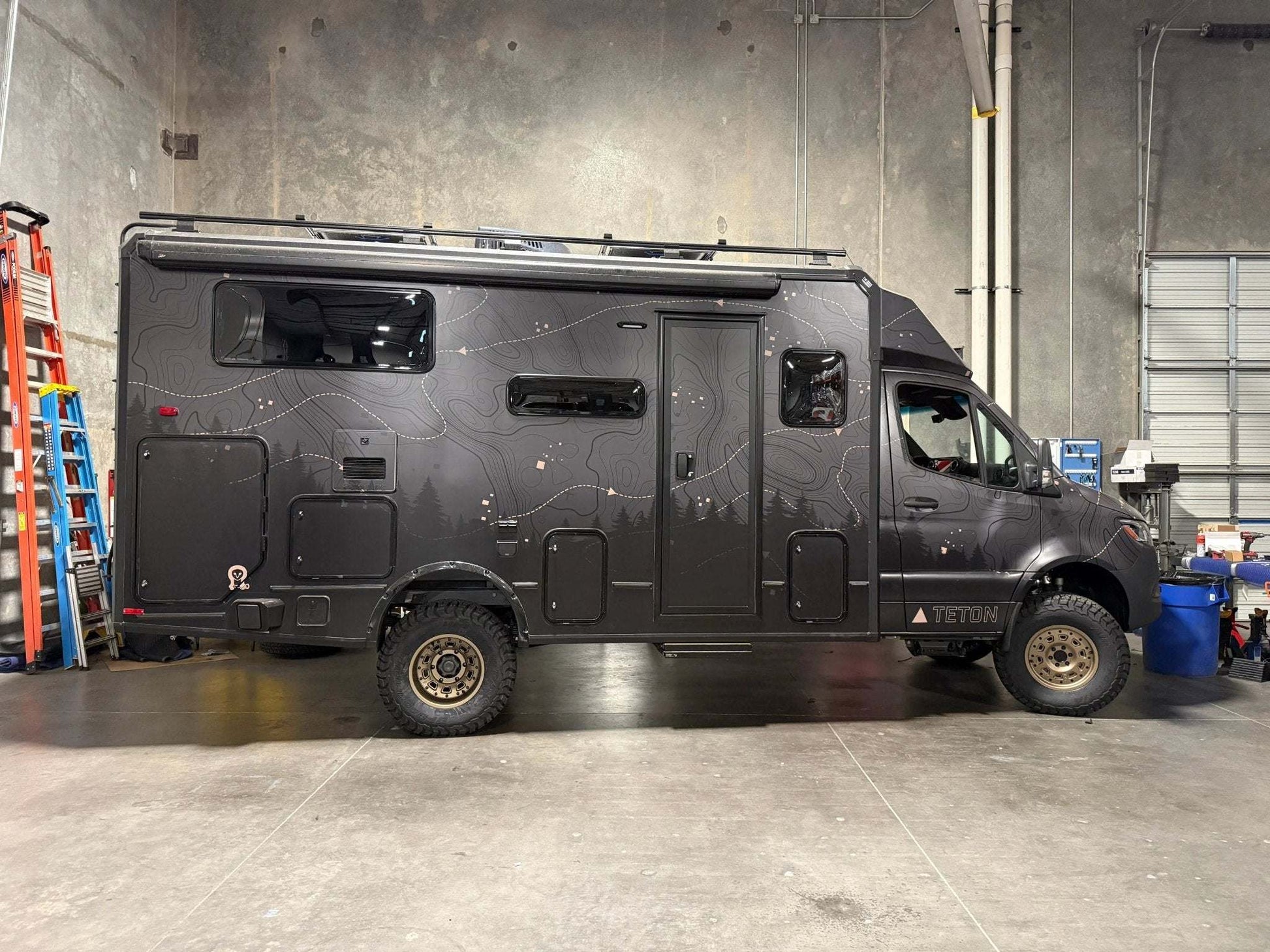Sprinter van equipped with Talon Super Single all-terrain wheel set for off-grid and overland adventure