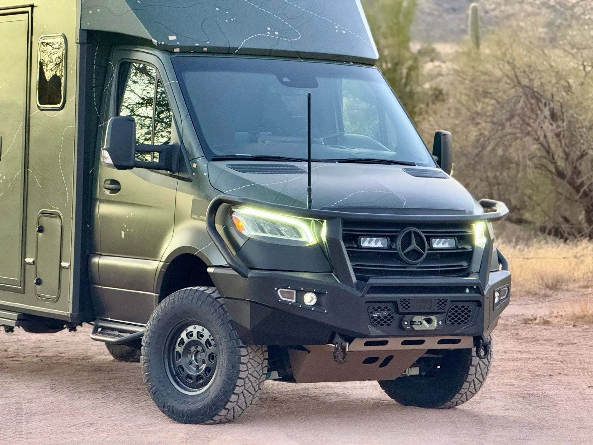 Sprinter van equipped with Talon Super Single off-road wheel set in desert setting