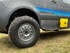 Off-road Sprinter with Super Single Spare Wheel and rugged tire on grass terrain