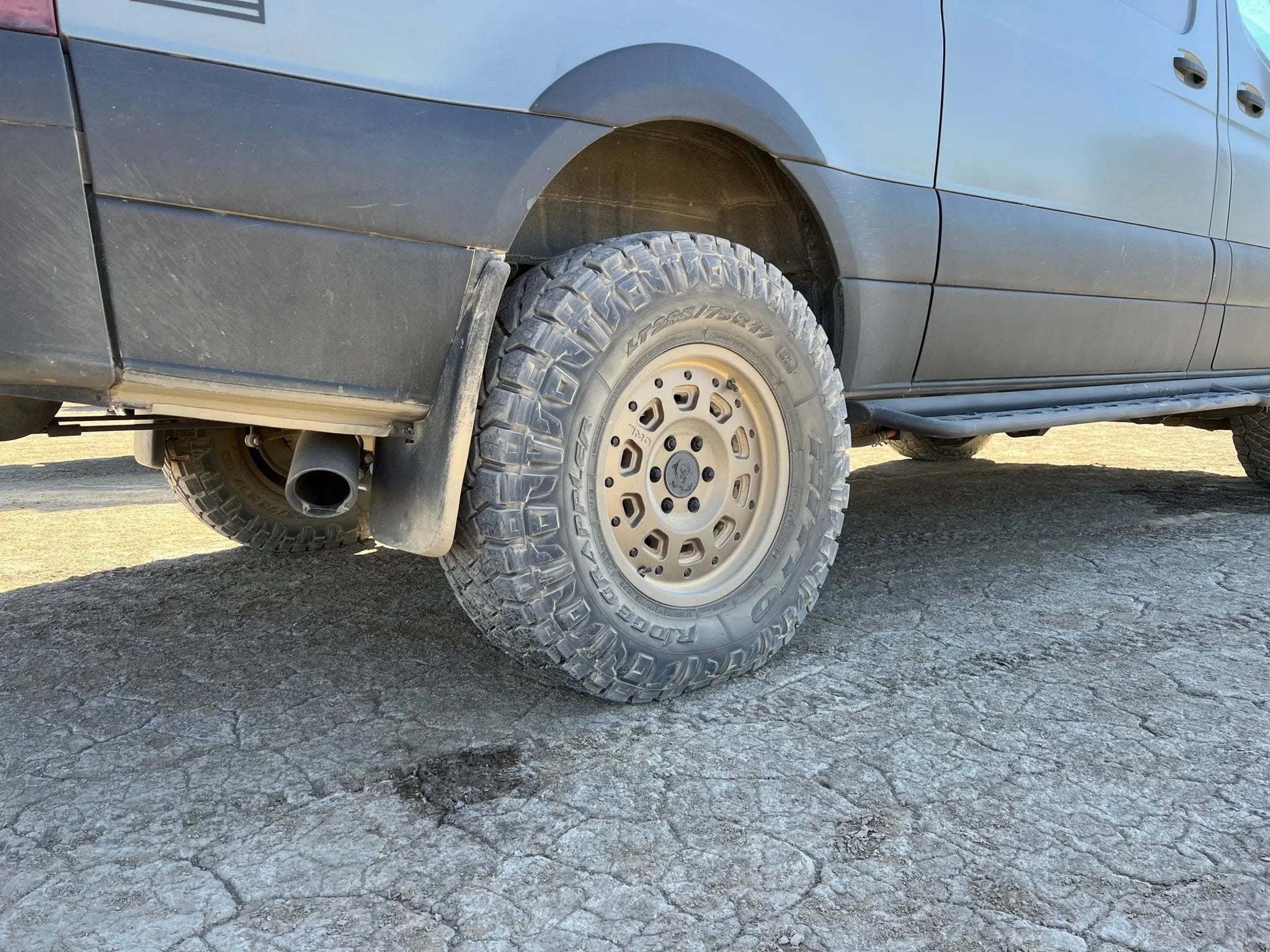 Super Single Spare Wheel installed on off-road Sprinter with rugged tire and matte black finish