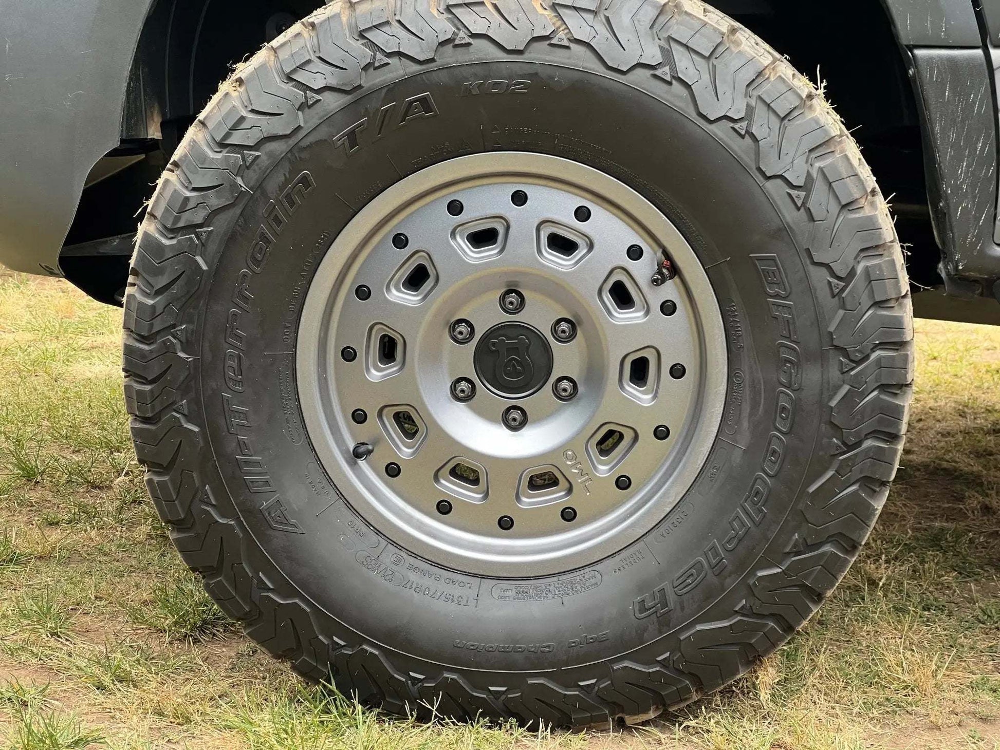 Super Single Spare Wheel with matte black finish and rugged off-road tire on vehicle