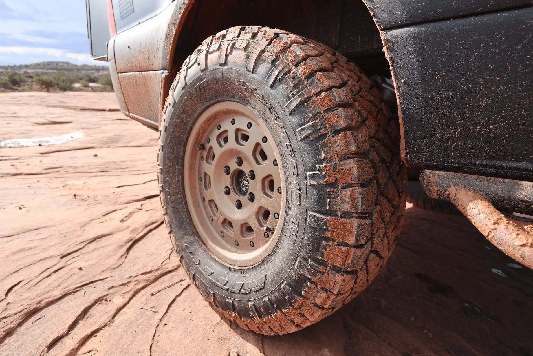 Super Single Spare Wheel by Owl with aggressive tread and matte black finish on off-road vehicle tire