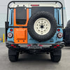 Tire Relocation Bracket for INEOS Grenadier on vehicle rear, showcasing durability and seamless integration.