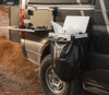 Magnetic Trail Trash holder attached to off-road vehicle with black trash bag for overlanding camping cleanup
