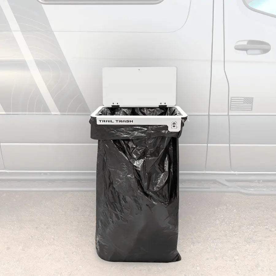 Magnetic Trail Trash holder attached to vehicle with black trash bag for camping waste disposal