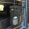 Camp Dish Drying Bag hanging in a van, used for drying and storing dishes with breathable mesh design.