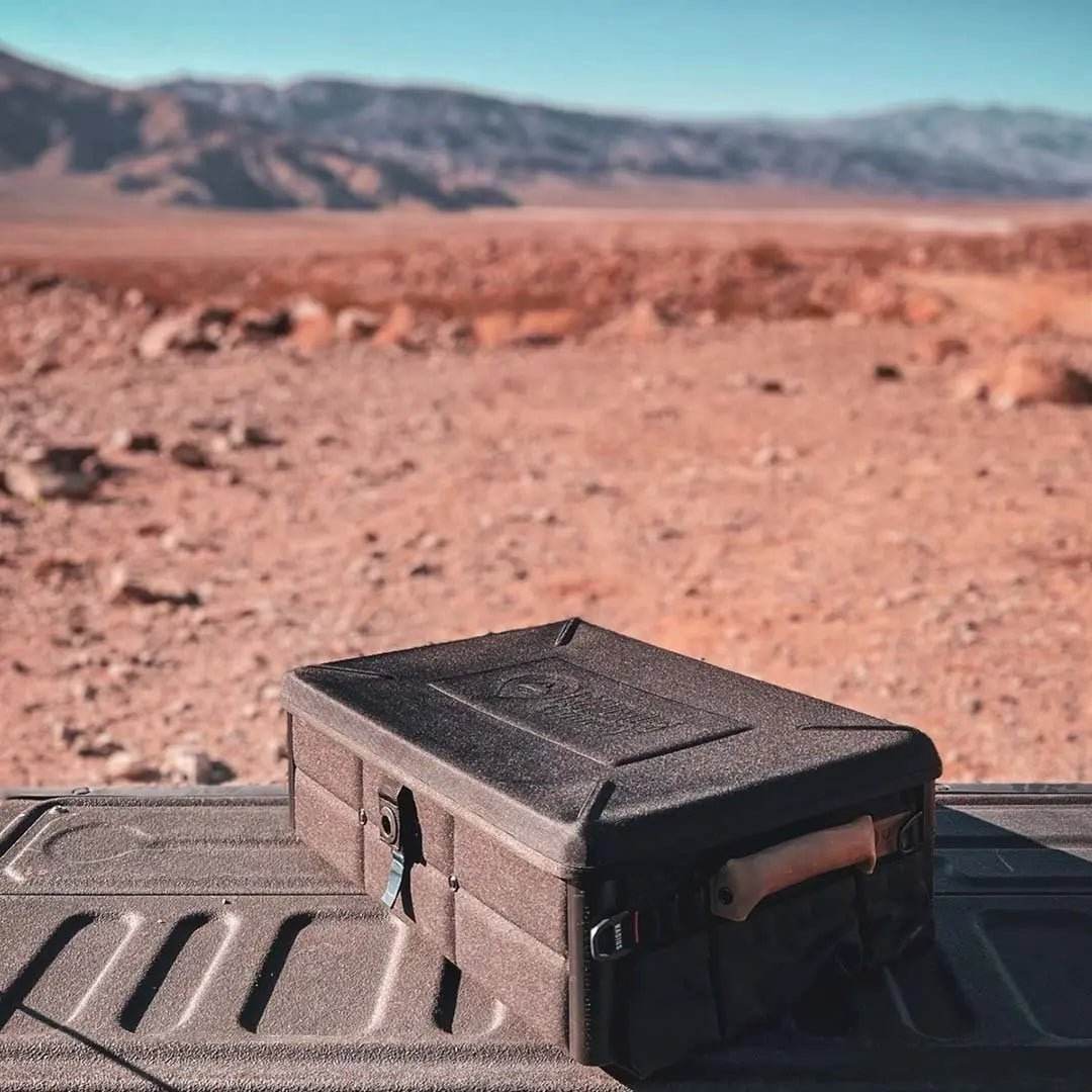 Gear Box 3500 on a rugged desert landscape, showcasing its durability and compact design.