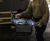 Large Utility Organizer with compartments and tools in use outdoors.
