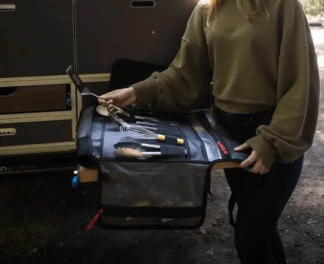 Large Utility Organizer with compartments and tools in use outdoors.