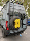 Yellow Rotopax 2-gallon fuel container mounted on vehicle.