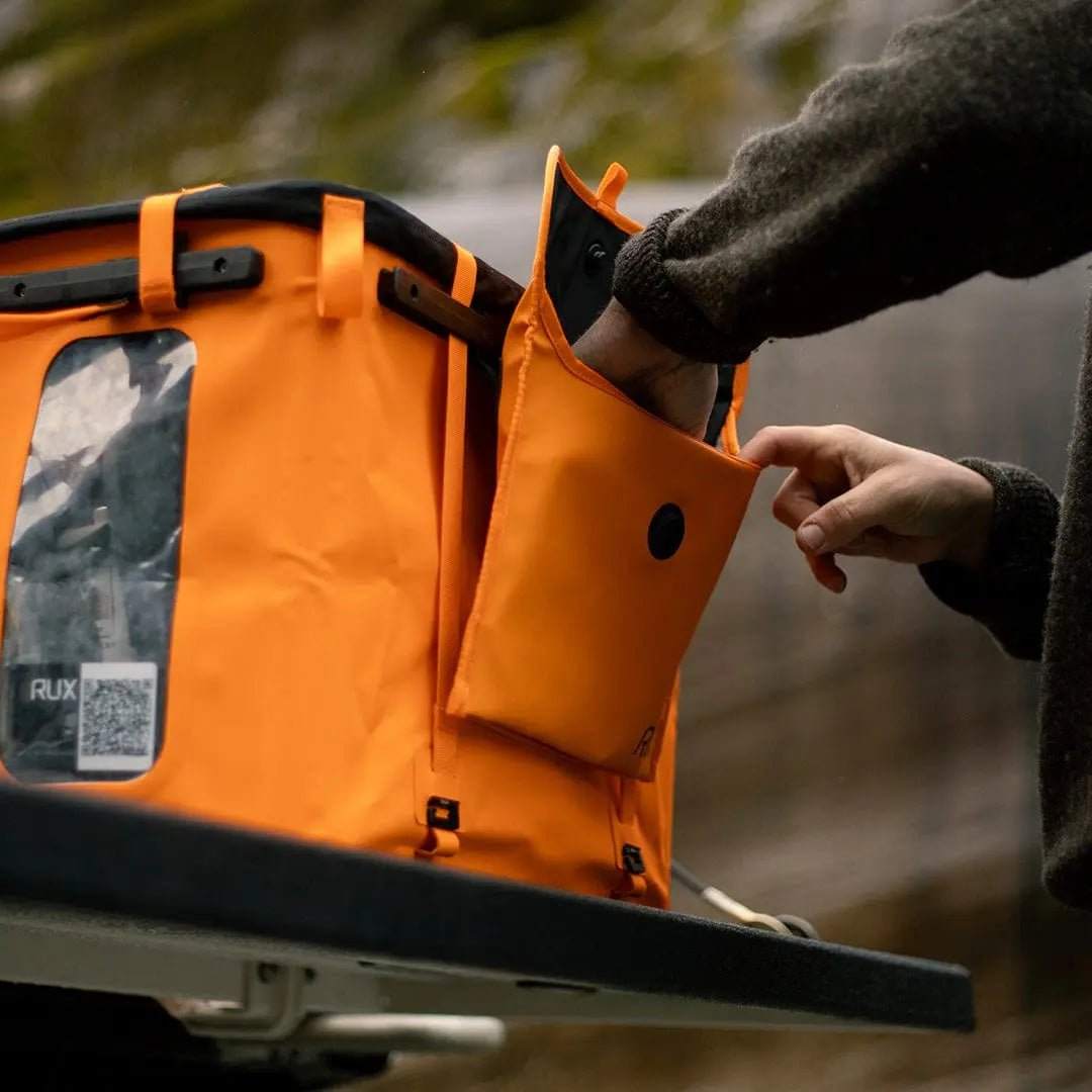 3L Pocket Modular Utility Pouch attached to orange gear box on adventure-ready setup.