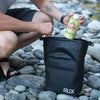 5L Cooler Cube in use by riverbank, durable and designed for adventure.
