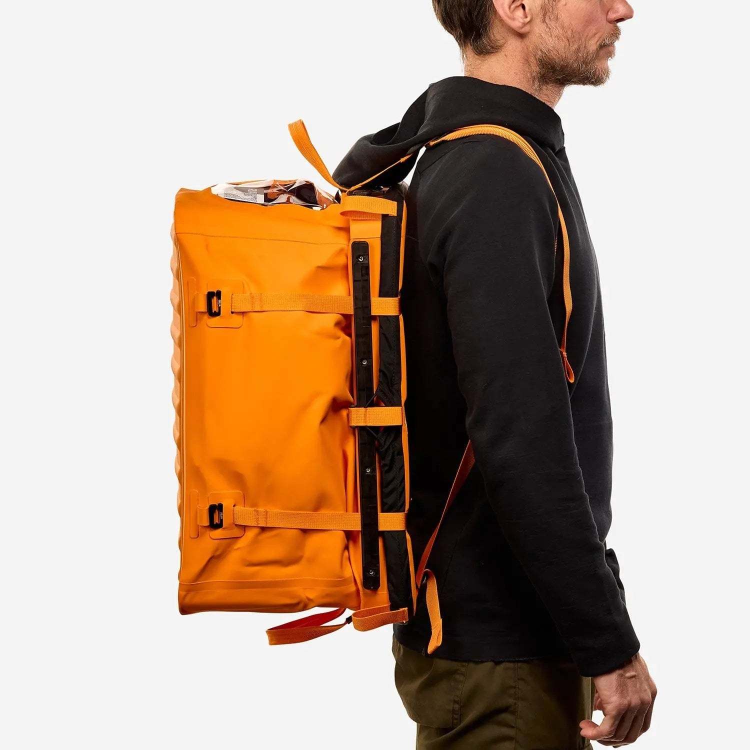 70L Storage Bag in use, showcasing durable and seamless design for adventure.