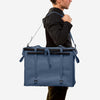 70L Storage Bag being carried, highlighting its durability and sleek design for adventure.