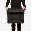 70L Storage Bag being held, showcasing durability and sleek design for adventure.