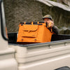 70L Storage Bag in truck bed, designed for rugged durability and adventure use.