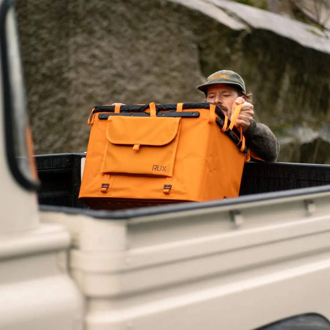 70L Storage Bag in truck bed, designed for rugged durability and adventure use.