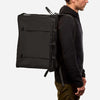 70L Storage Bag on person for scale, ideal for off-grid and overland setups.