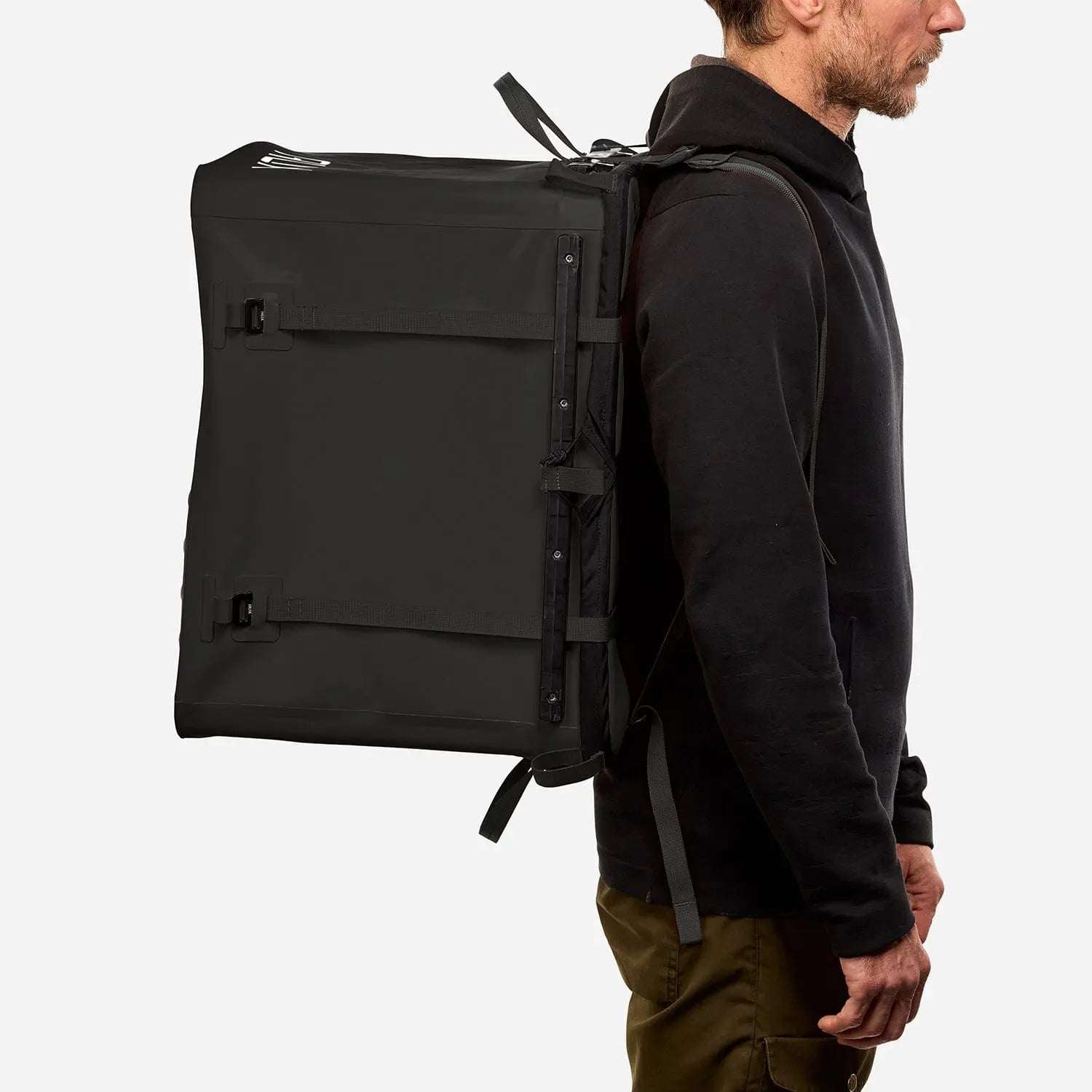 70L Storage Bag on person for scale, ideal for off-grid and overland setups.