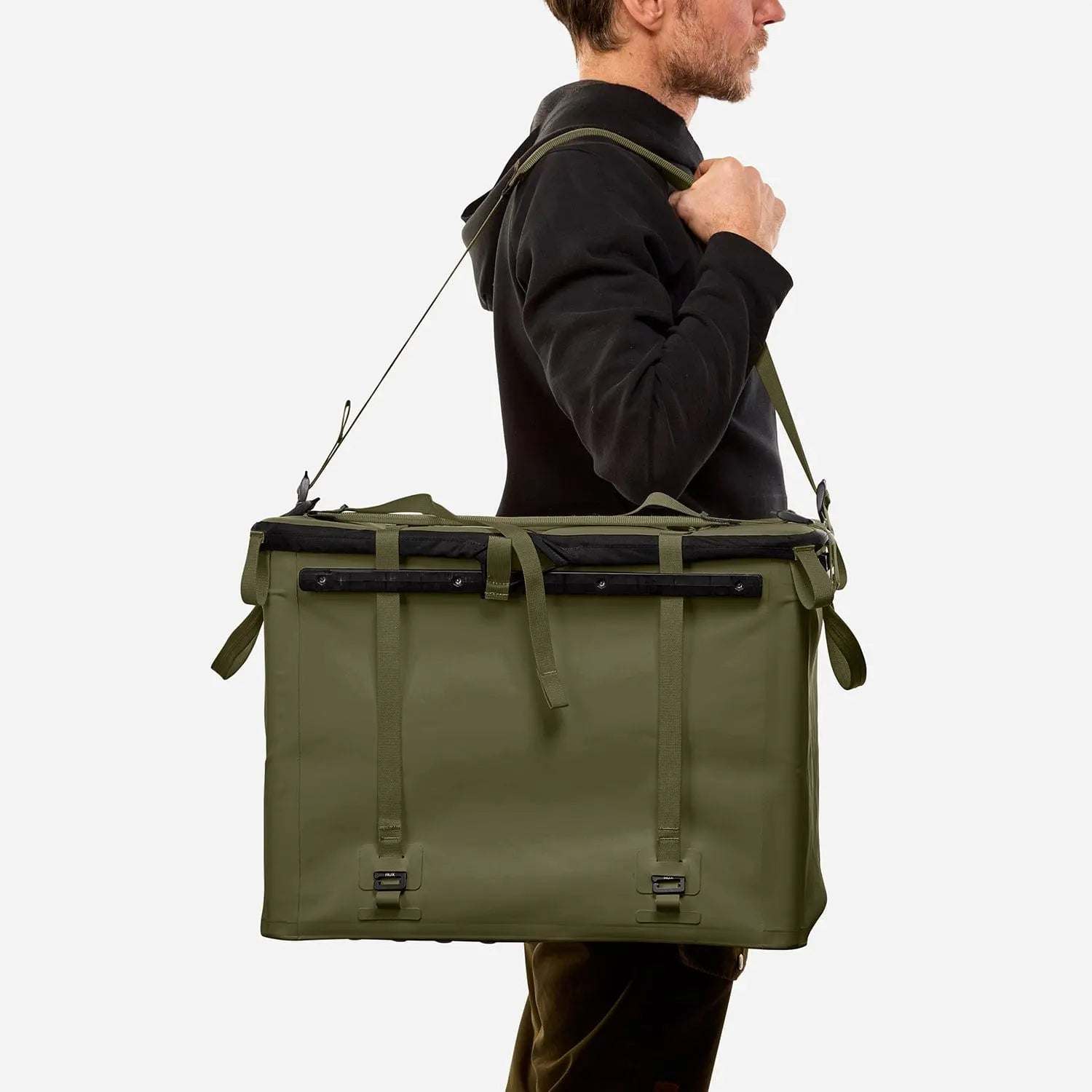 70L Storage Bag for adventure and durability, carried by person.