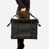 70L Storage Bag held by a person, showcasing durable and adventure-ready design.