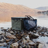 Essentials Set by RUX on rocky lakeshore, showcasing durable design for adventure and overland setups.