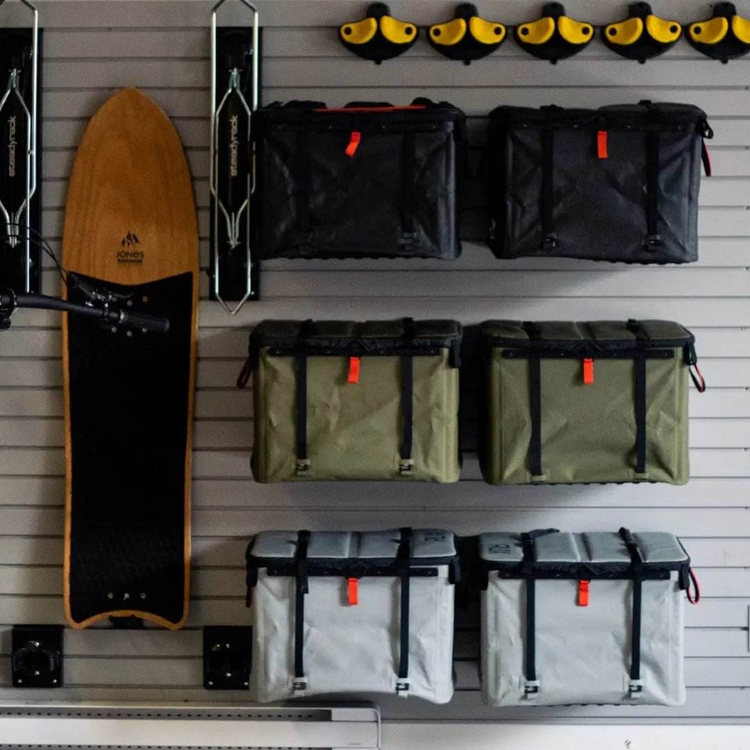 Utility hooks organizing gear for overland setup.