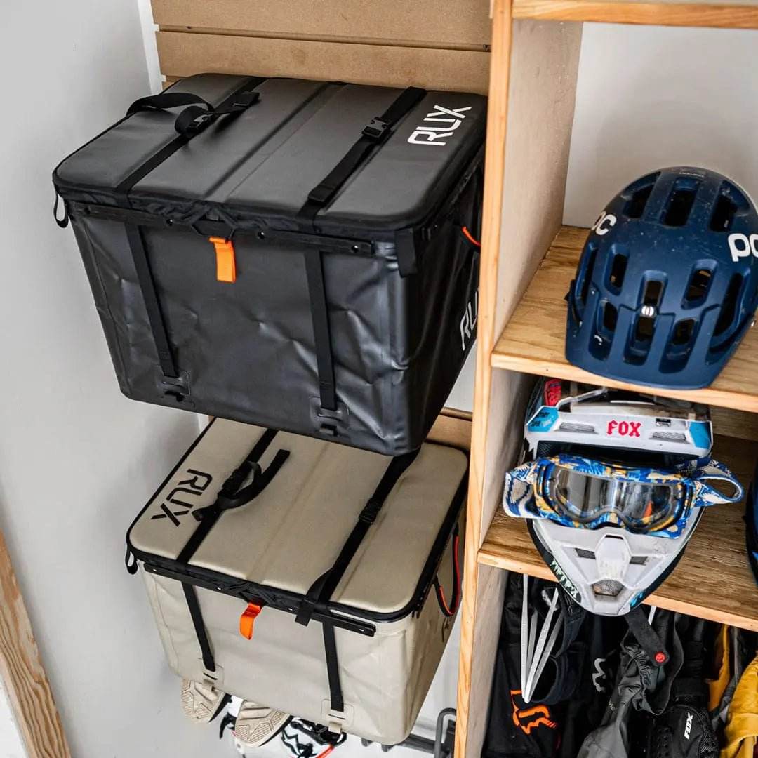 Utility hooks holding gear and storage boxes for organized overland setups.