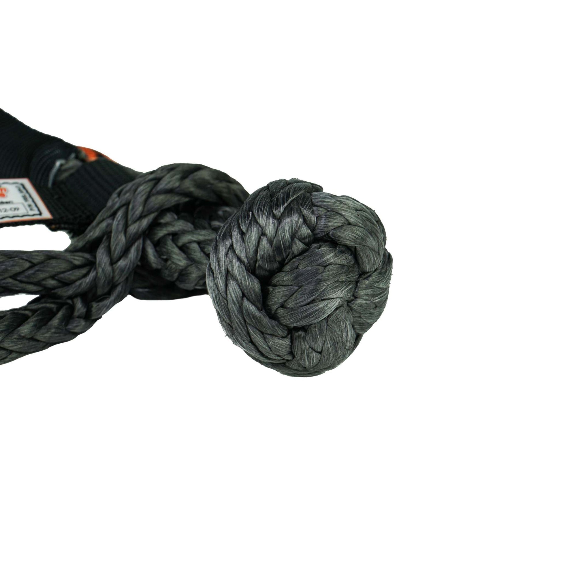 Black high-strength synthetic soft shackle with protective sleeve and 7/16" diameter for heavy-duty recovery use
