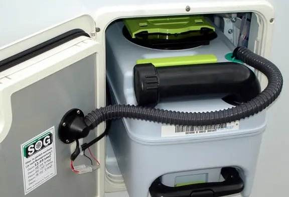 Toilet cassette with active charcoal vent system for off-grid living.