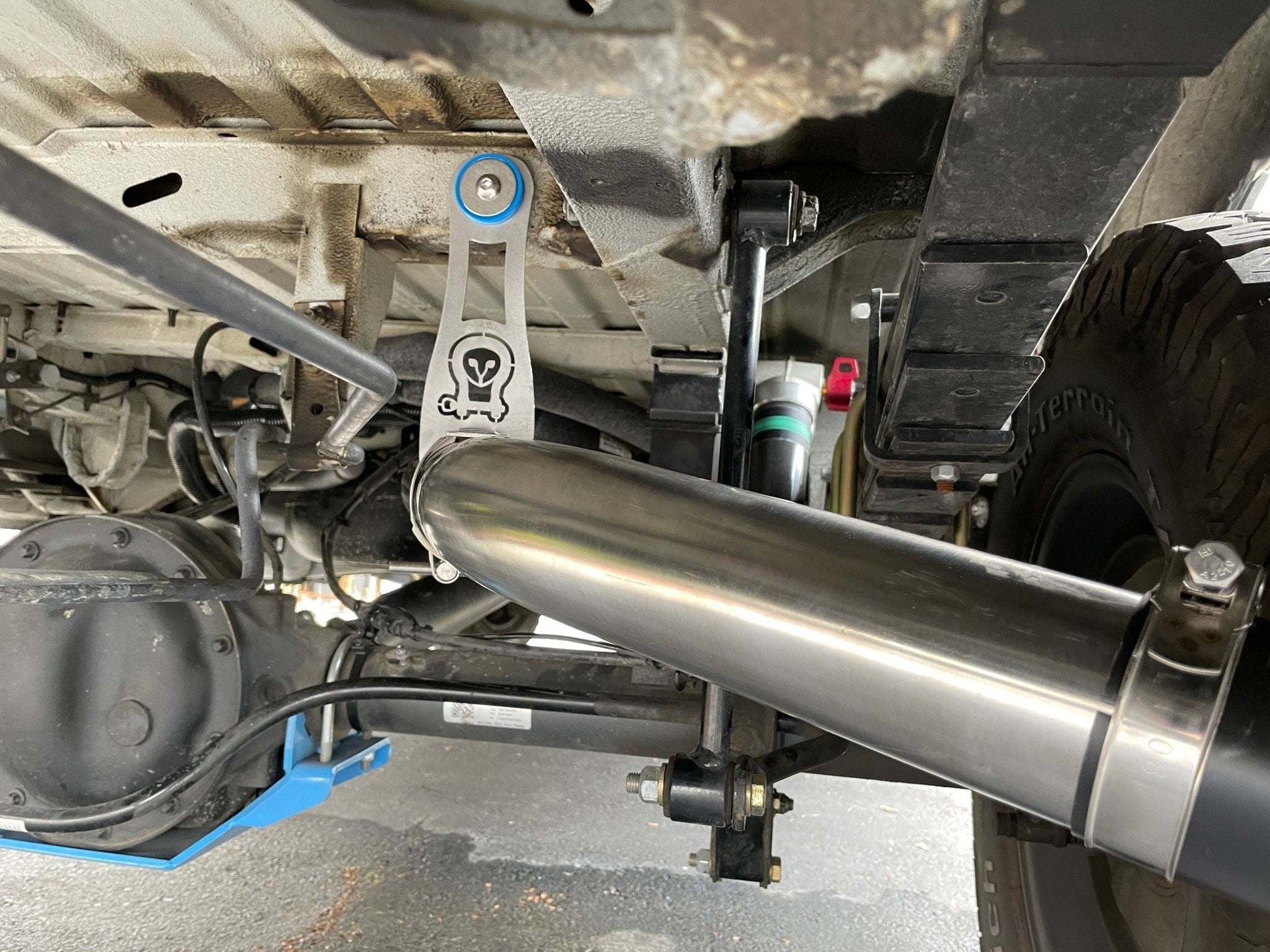 Owl Stainless Exhaust installed under 144" Sprinter van with stainless steel pipe and custom hanger bracket