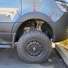Fender flares on a 2019+ Sprinter with oversized tires, enhancing protection and styling.