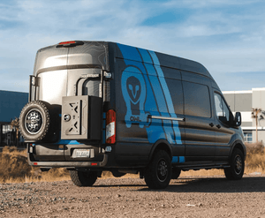 Interior view of Ford Transit van equipped with rugged accessories and storage solutions for overland adventures