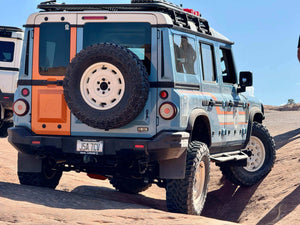 Close-up view of INEOS Grenadier suspension system showcasing rugged off-road components and durable design