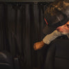 Black dual-layer insulated Sprinter Curtain with magnetic tabs for temperature control and privacy between cab and living space.