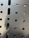Close-up of lightweight aluminum Sprinter Cargo Carrier rear door panel with precision CNC-machined holes and slots for modular gear mounting