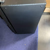 Black metal van storage box with welded edges on a blue padded surface