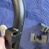 Close-up of black steel arm of Sprinter Bike Rack and Box Carrier on blue padded surface with foam packaging pieces