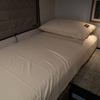Ultra Luxe Dream Sheets fitted on a compact van bed with matching pillowcases, showcasing smooth, wrinkle-free microfiber bedding tailored for van life.