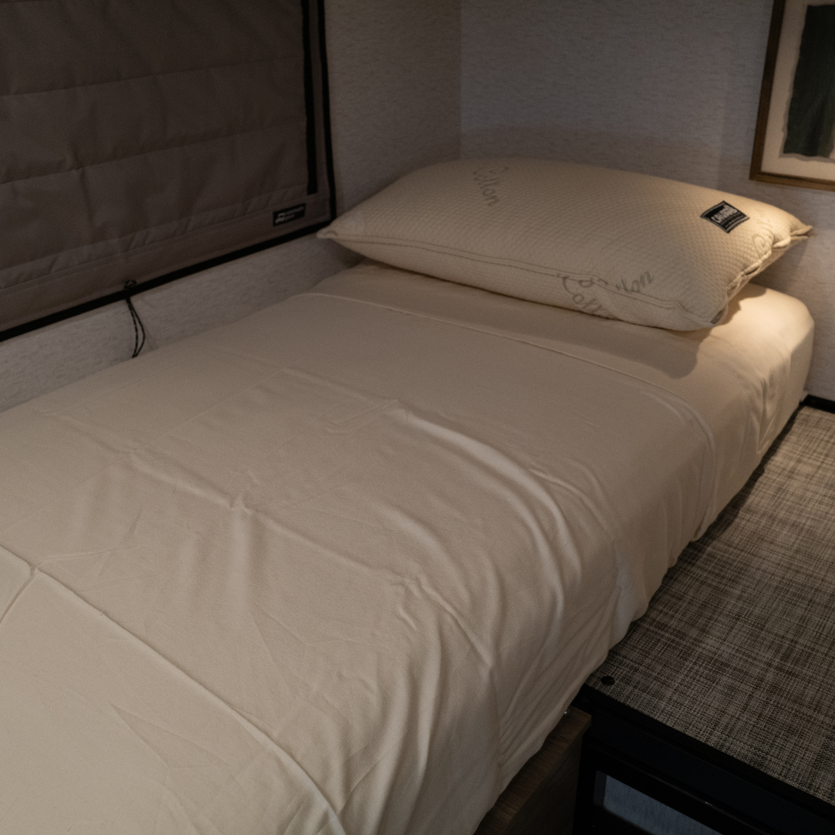 Ultra Luxe Dream Sheets fitted on a compact van bed with matching pillowcases, showcasing smooth, wrinkle-free microfiber bedding tailored for van life.