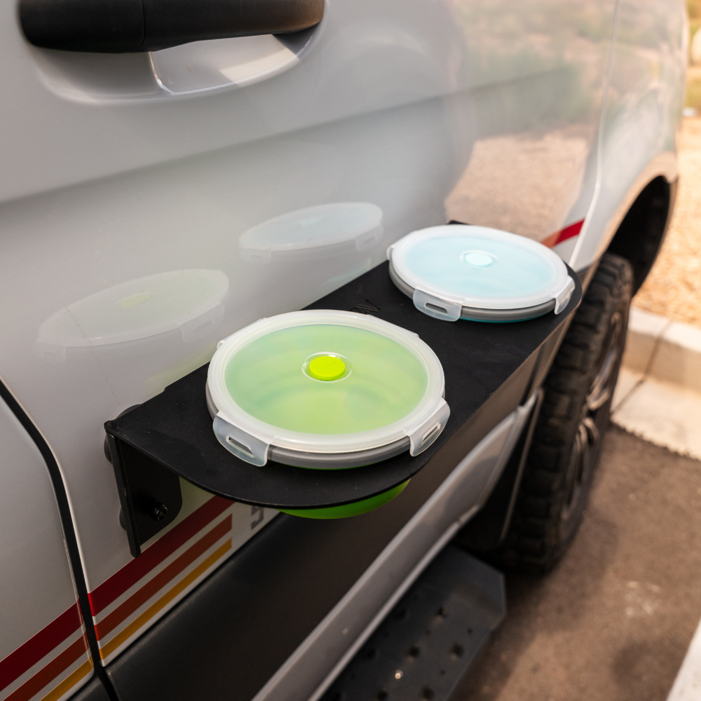 Canyon Pet Bowl mounted on car door for stable travel feeding and mess-free pet dining.