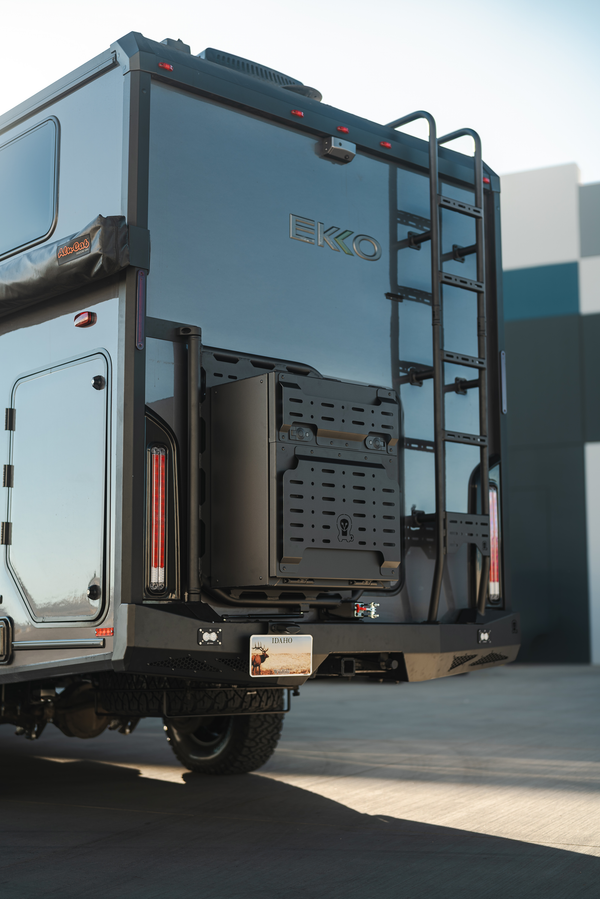 Sprinter Ekko camper rear view showing Owl Teton Series steel rear carrier system with swing-out cargo box and aluminum ladder