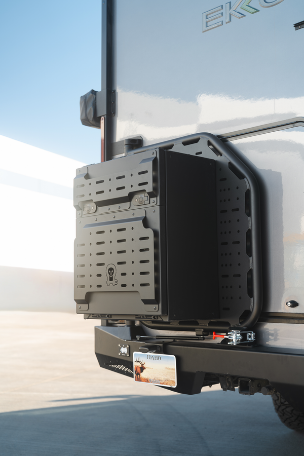 Teton rear carrier system mounted on Winnebago Ekko with swing-out spare wheel and cargo box carrier and aluminum ladder