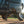 Sprinter van lifted with high performance bottle jack on dirt trail
